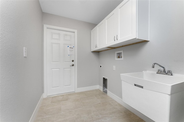 clothes washing area with sink, hookup for a washing machine, hookup for an electric dryer, and cabinets