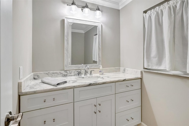 bathroom featuring vanity and ornamental molding