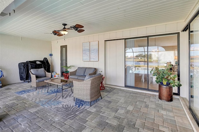 view of patio with ceiling fan and outdoor lounge area