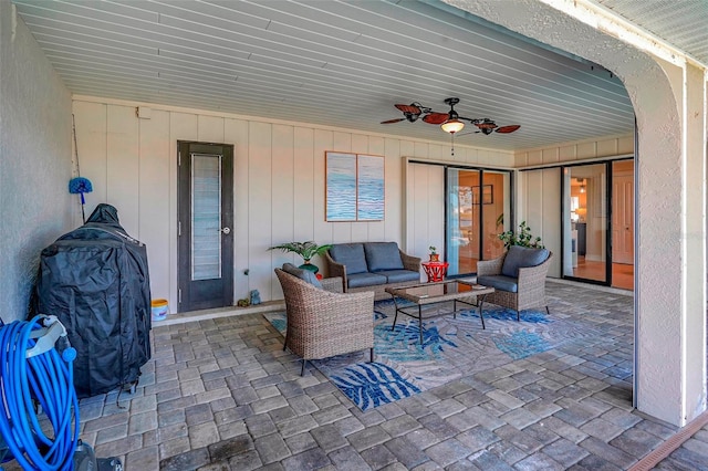 view of patio with outdoor lounge area and ceiling fan