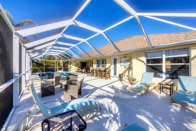 view of patio with a lanai