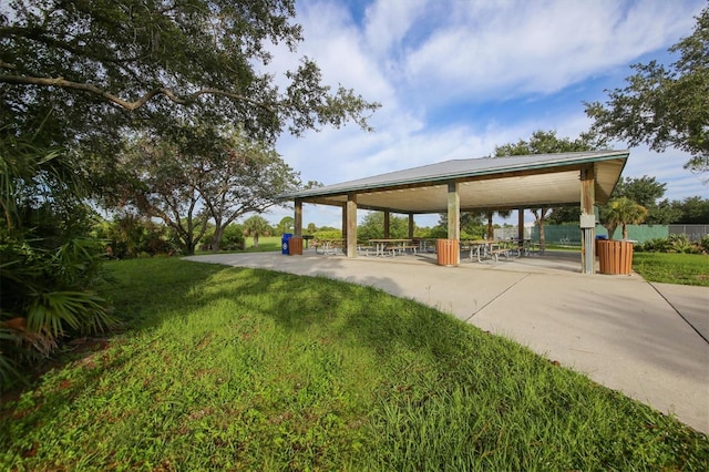 view of home's community featuring a patio, a gazebo, and a lawn