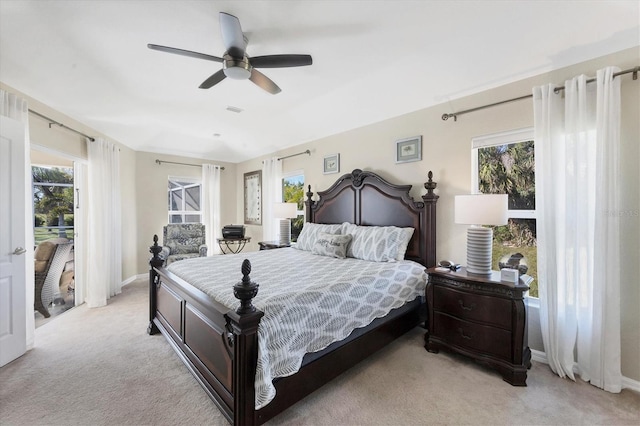 bedroom with light colored carpet and ceiling fan