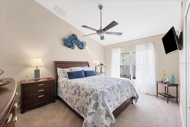 bedroom featuring ceiling fan, light carpet, and lofted ceiling