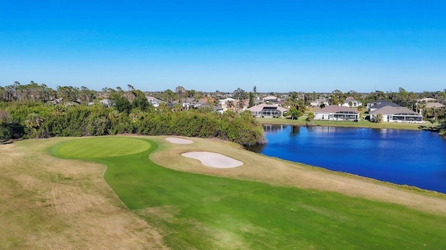 surrounding community featuring a water view