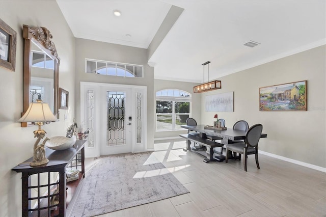 entryway featuring ornamental molding