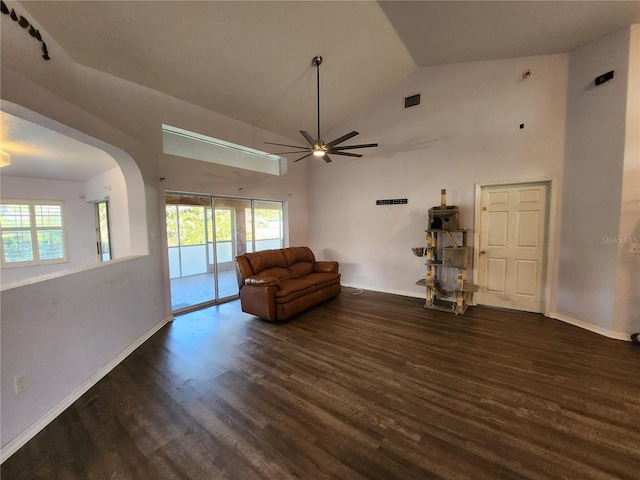 unfurnished living room with dark hardwood / wood-style floors, ceiling fan, and high vaulted ceiling