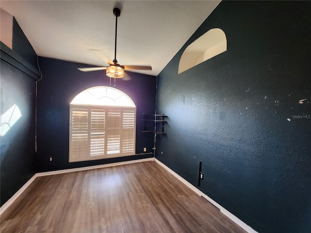 empty room featuring wood-type flooring and ceiling fan