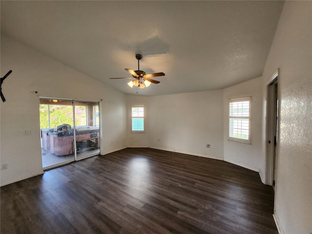 unfurnished room featuring vaulted ceiling, ceiling fan, and dark wood-type flooring