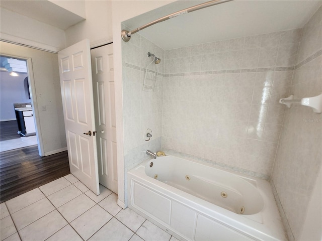 bathroom with tile patterned flooring and tiled shower / bath combo