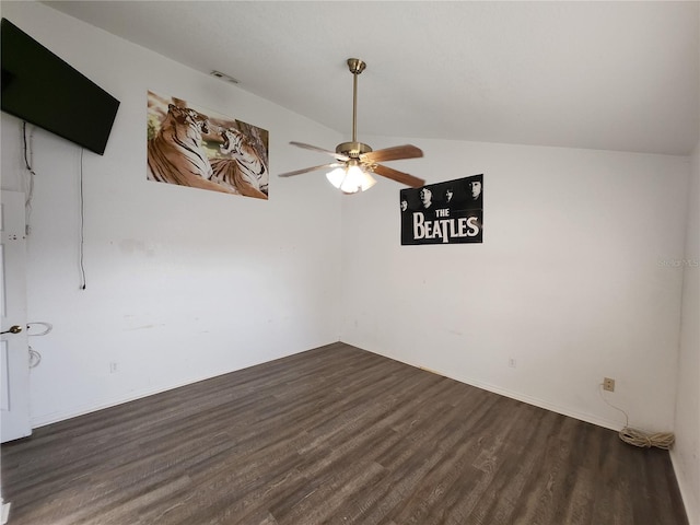 unfurnished room featuring lofted ceiling, ceiling fan, and dark wood-type flooring