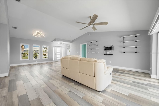 unfurnished living room with ceiling fan, light hardwood / wood-style floors, and lofted ceiling