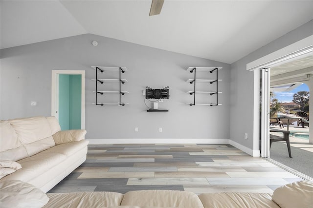 unfurnished living room featuring vaulted ceiling and light wood-type flooring