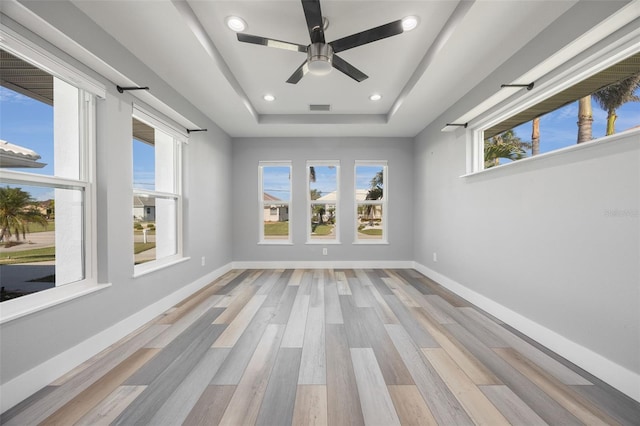 525 Madrid Blvd, Punta Gorda, FL 33950 - spare room featuring a tray ceiling, wood finished floors, recessed lighting, and ceiling fan