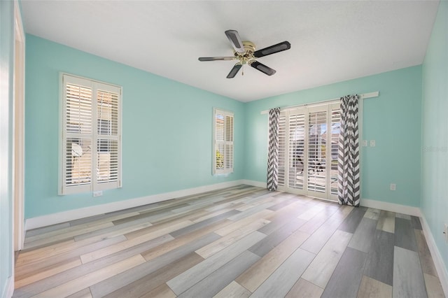 empty room featuring light hardwood / wood-style floors and ceiling fan