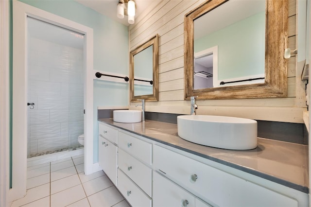 525 Madrid Blvd, Punta Gorda, FL 33950 - bathroom with double vanity, tile patterned floors, wood walls, and tiled shower