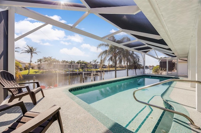 view of swimming pool featuring a lanai and a water view