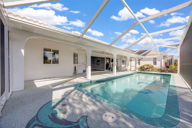 view of swimming pool with a lanai and a patio area