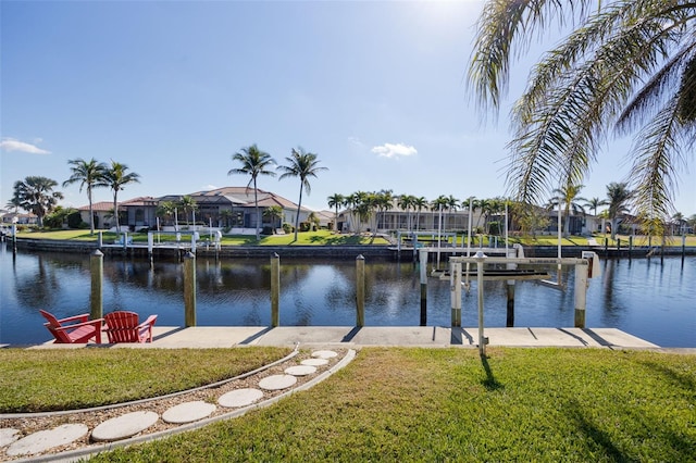 dock area featuring a yard and a water view