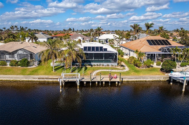 525 Madrid Blvd, Punta Gorda, FL 33950 - dock featuring boat lift, a residential view, a water view, and a lanai