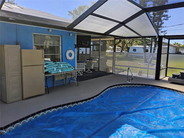 view of pool with a lanai