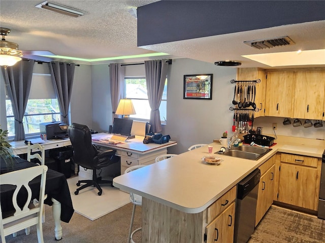 kitchen with kitchen peninsula, a textured ceiling, stainless steel dishwasher, and sink