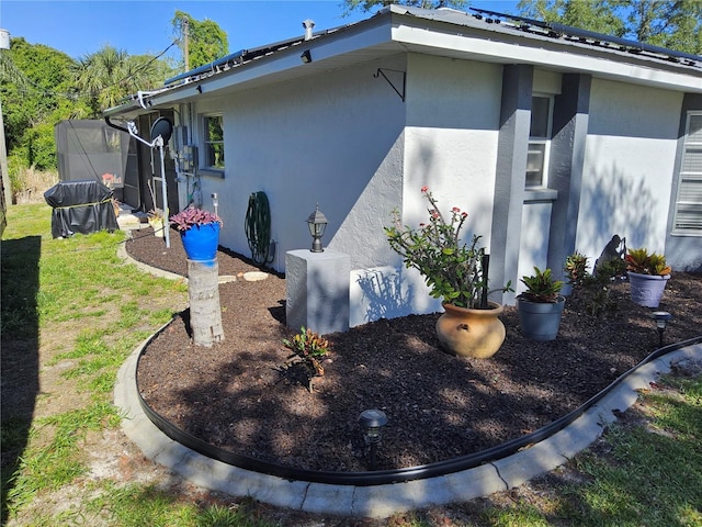 view of side of home featuring a yard