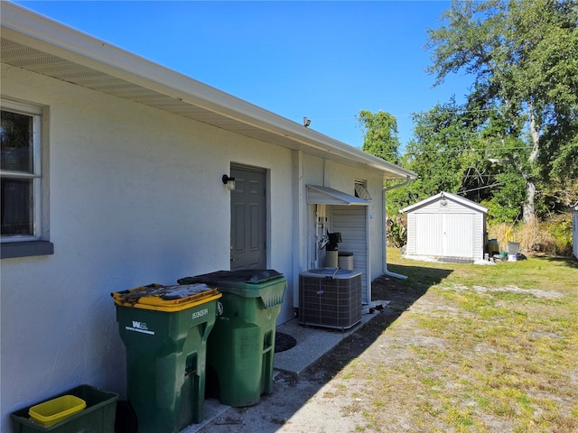 view of yard with a storage unit and cooling unit