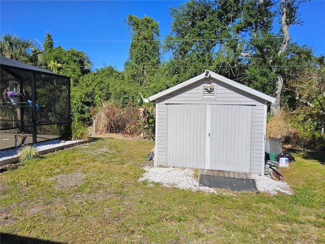 view of outdoor structure with a lawn