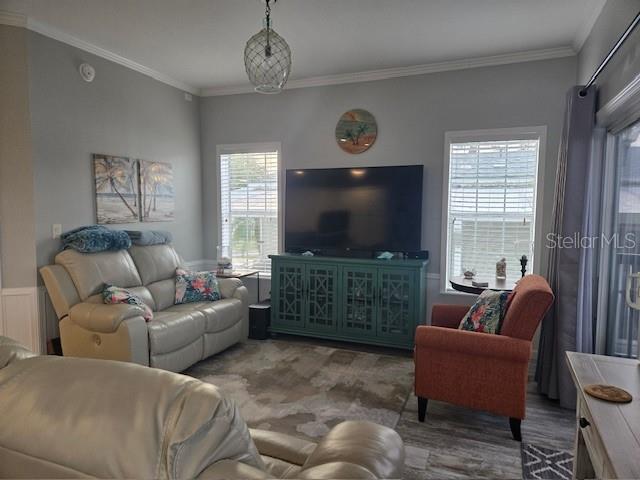 living room featuring crown molding