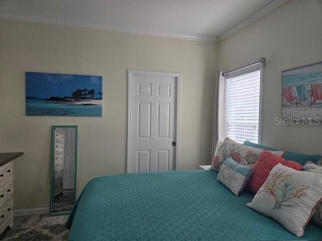 bedroom with ornamental molding