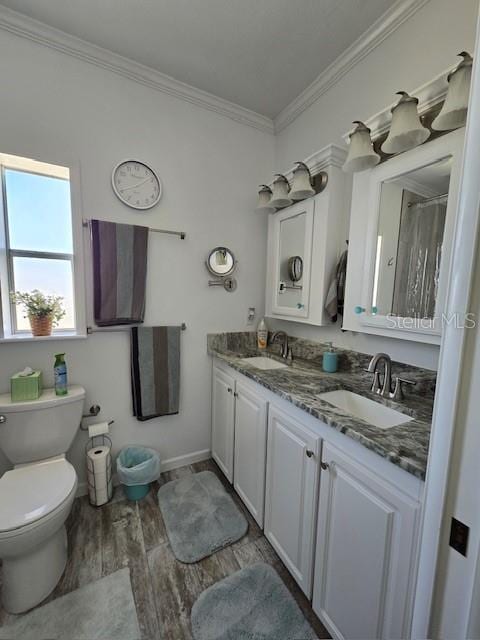 bathroom with walk in shower, wood-type flooring, toilet, vanity, and ornamental molding