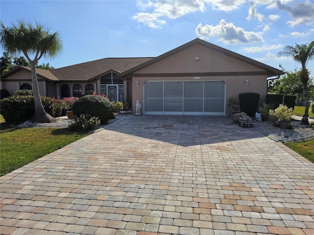 single story home featuring a garage