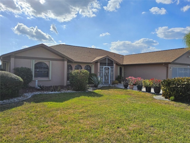 ranch-style house with a front lawn