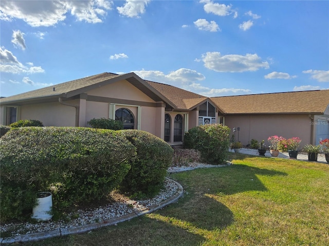 ranch-style home with a front yard