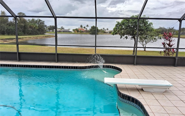 view of pool with glass enclosure, a diving board, a water view, and pool water feature