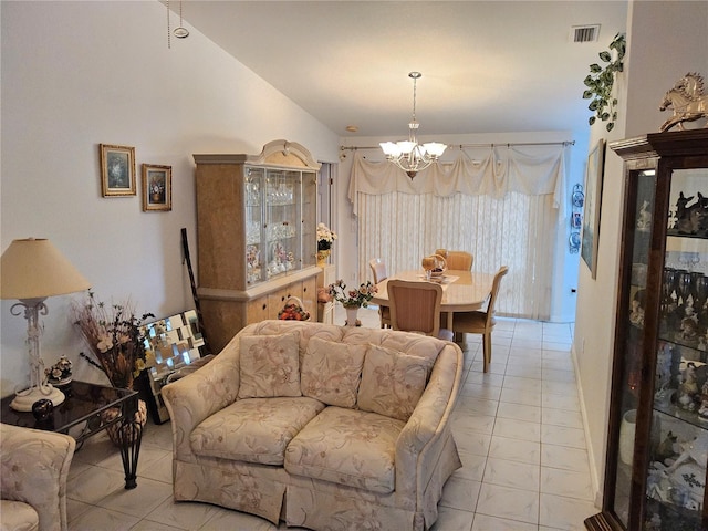 tiled living room with an inviting chandelier and vaulted ceiling