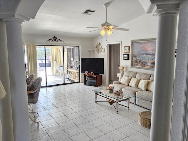 living room with decorative columns, ceiling fan, and light tile patterned flooring