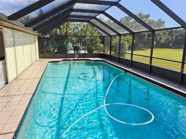 view of pool featuring glass enclosure