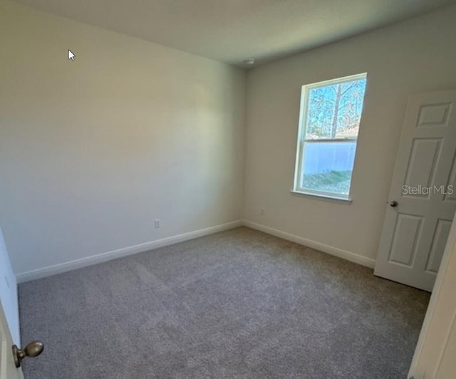 view of carpeted spare room