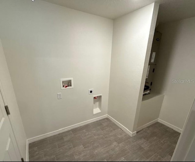 laundry area featuring wood-type flooring, electric dryer hookup, and washer hookup