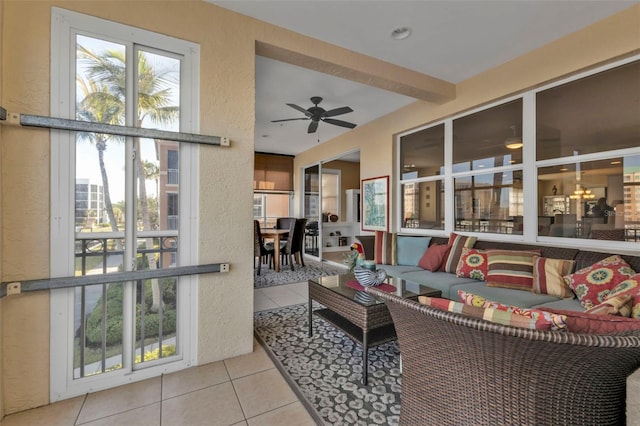 interior space with beam ceiling and ceiling fan with notable chandelier