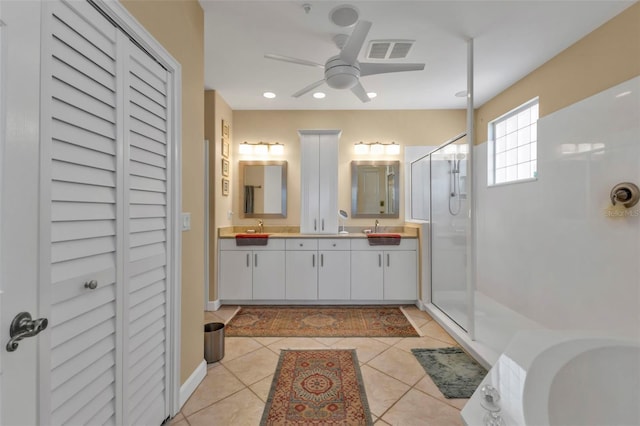 bathroom featuring tile patterned floors, vanity, ceiling fan, and a shower with shower door