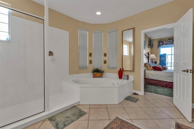 bathroom featuring tile patterned floors and a tub