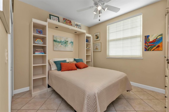 tiled bedroom with ceiling fan