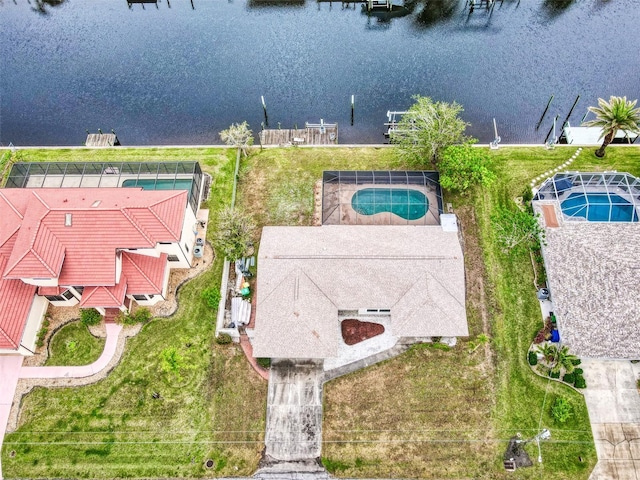 birds eye view of property with a water view