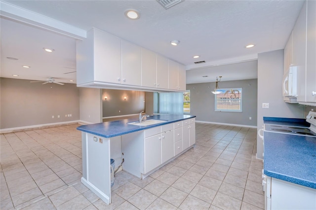 kitchen with sink, ceiling fan, decorative light fixtures, light tile patterned flooring, and white cabinetry