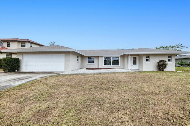 view of front of property with a front yard and a garage