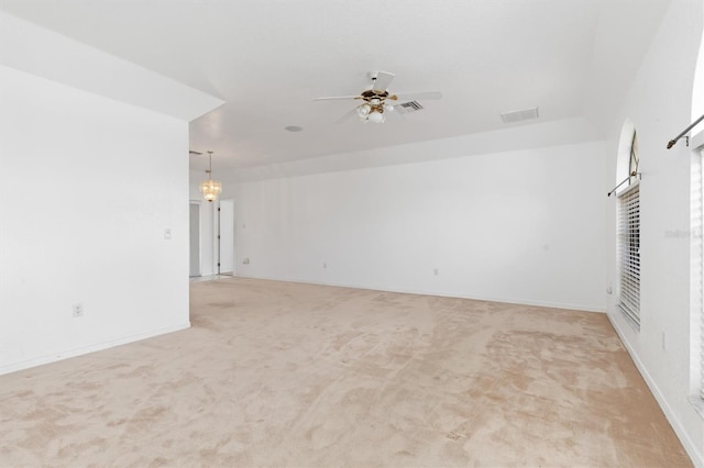 carpeted spare room with ceiling fan