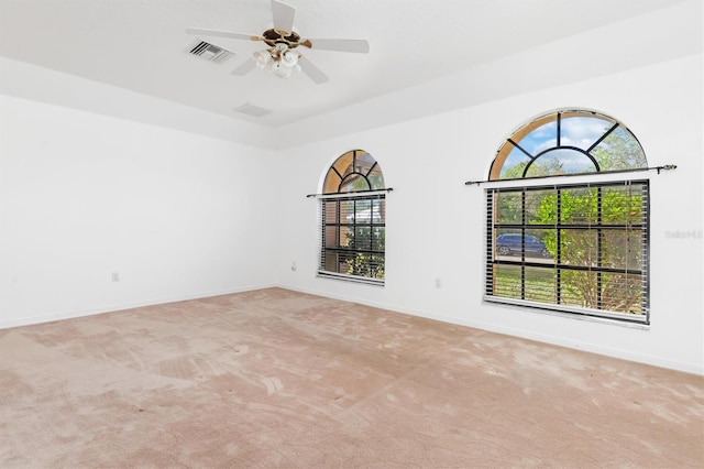 carpeted empty room with ceiling fan